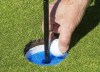 A plastic insert installed in the hole to help golfers retrieve their ball without touching the flagstick is shown on Wednesday May 20, 2020 in Laval, Quebec. As each provincial golf association has planned its respective amateur championships, organizers have had to take a back-to-basics approach to keep players, officials, and volunteers safe from COVID-19. THE CANADIAN PRESS/Ryan Remiorz