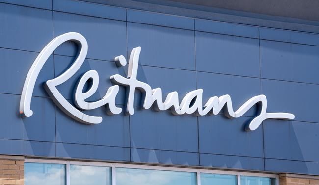 A Reitmans sign is seen on a store front in Montreal on Tuesday, June 18, 2019. Reitmans (Canada) Ltd. says it is seeking court protection from its creditors under the Companies' Creditors Arrangement Act in order to allow a restructuring of the retailer. THE CANADIAN PRESS/Paul Chiasson