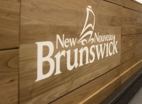 A New Brunswick logo is shown during a press conference in Fredericton, New Brunswick on Monday February 17, 2020. New Brunswick's Public Safety Minister says restaurants and other places where there are large gatherings are required to collect the names and contact information of patrons in case there's an outbreak of COVID-19. THE CANADIAN PRESS/Stephen MacGillivray