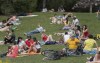 People enjoy a warm sunny day in a city park in Montreal, Sunday May 24, 2020, as the COVID-19 pandemic continues in Canada and around the world. THE CANADIAN PRESS/Graham Hughes