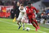 Leipzig's Dani Olmo, left, and Bayern's Alphonso Davies challenge for the ball during the German Bundesliga soccer match between Bayern Munich and RB Leipzig at the Allianz Arena in Munich, Germany, Sunday, Feb. 9, 2020. Canadian international Davies' remarkable season continued Friday when he was voted Bundesliga rookie of the year. THE CANADIAN PRESS/AP, Matthias Schrader