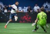 Vancouver Whitecaps' Ali Adnan, left, is stopped by Sporting Kansas City goalkeeper Tim Melia during the second half of an MLS soccer game in Vancouver, on Saturday, July 13, 2019. Looking to embrace their multicultural home and welcome potential fans father afield, the Vancouver Whitecaps unveiled official club Twitter feeds in nine new languages Monday. THE CANADIAN PRESS/Darryl Dyck