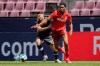 Cologne's Kingsley Ehizibue, left, and Freiburg's Vincenzo Grifo, right, challenge for the ball during the German Bundesliga soccer match between 1. FC Cologne and SC Freiburg in Cologne, Germany, Sunday, May 9, 2021. (Rolf Vennenbernd/dpa via AP)