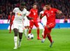 FILE - In this Sunday, Feb. 9, 2020 file photo Leipzig's Dayot Upamecano, left, and Bayern's Serge Gnabry challenge for the ball during the German Bundesliga soccer match between Bayern Munich and RB Leipzig at the Allianz Arena in Munich, Germany. (AP Photo/Matthias Schrader, file)