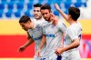 Schalke's scorer Mark Uth, second right, and his teammates celebrate the opening goal during the German Bundesliga soccer match between TSG 1899 Hoffenheim in FC Schalke 04 in Sinsheim, Germany, Saturday, May 8, 2021. (Uwe Anspach/dpa via AP)