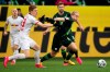 Leipzig's Marcel Halstenberg, left, and Wolfsburg's Xaver Schlager, right, challenge for the ball during the German Bundesliga soccer match between VfL Wolfsburg and RB Leipzig in Wolfsburg, Germany, Saturday, March 7, 2020. (Swen Pfoertner/dpa via AP)