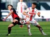 Frankfurt's Makoto Hasebe, left, and Cologne's Salih Ozcan, right, challenge for the ball during the German Bundesliga soccer match between Eintracht Frankfurt and 1. FC Cologne in Frankfurt, Germany, Sunday, Feb. 14, 2021. (Thomas Frey/dpa via AP)