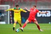Union's Grischa Proemel, right, and Cologne's Elvis Rexhbecaj, left, challenge for the ball during the German Bundesliga soccer match between 1. FC Union Berlin and 1. FC Cologne in Berlin, Germany, Saturday, March 13, 2021. (Andreas Gora/dpa via AP)