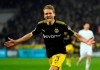 FILE - In this Friday, Feb. 2, 2018 file photo, Dortmund's Andre Schuerrle celebrates after scoring his side's third goal during the German Bundesliga soccer match between 1. FC Cologne and Borussia Dortmund in Cologne, Germany. Borussia Dortmund has released World Cup-winning forward Andre Schuerrle from his contract a year early, the German club said Wednesday. The 29-year-old Schuerrle last played for Dortmund in May 2018 before loans at Fulham and Spartak Moscow. (AP Photo/Martin Meissner, file)