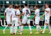 Moenchengladbach's scorer Ramy Bensebaini, center, and his teammates celebrate their side's fourth goal during the German Soccer Cup first round match between Borussia Moenchengladbach and FC Oberneuland in Moenchengladbach, Germany, Saturday, Sept. 12, 2020. (Bernd Thissen/dpa via AP)