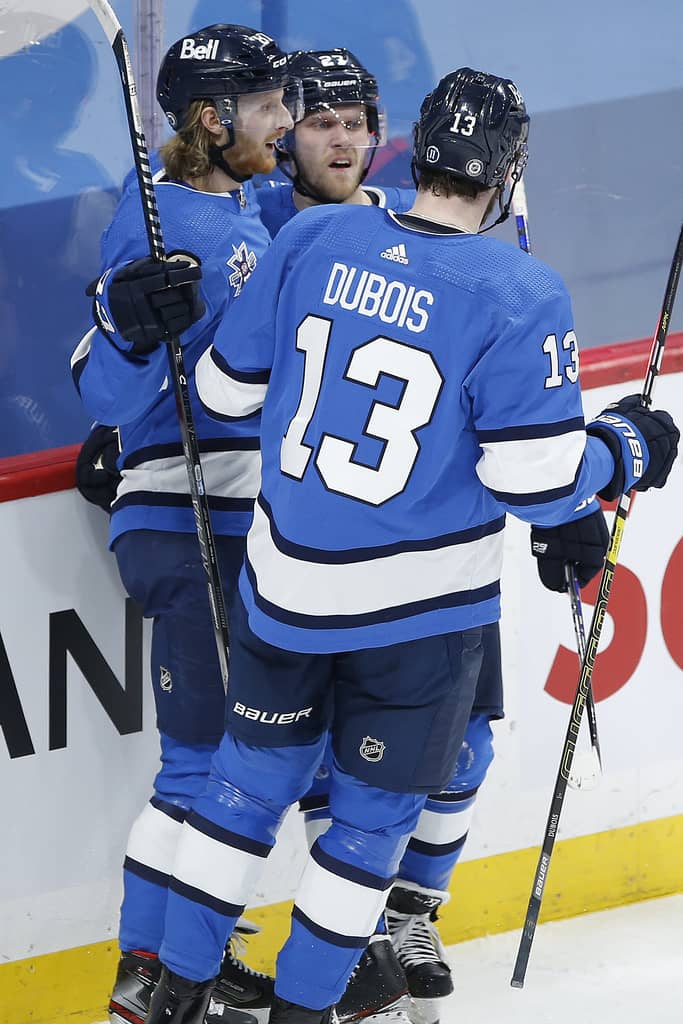 THE CANADIAN PRESS
Dubois celebrates a goal against the Montreal Canadiens with linemates Kyle Connor and Nikolaj Ehlers during the first period on Wednesday. THE CANADIAN PRESS/John Woods