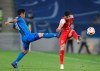 Ulsan Hyundai's Lee Keun-Ho, left, and Saeid Aghaei of Persepolis fight for the ball during the AFC Champions League final match in Al Wakrah, Qatar, Saturday, Dec. 19, 2020. (AP Photo/Hussein Sayed)