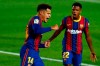 Barcelona's Philippe Coutinho celebrates scoring the opening goal with Barcelona's Ansu Fati, during the Spanish La Liga soccer match between FC Barcelona and Sevilla FC at the Camp Nou stadium in Barcelona, Spain, Sunday, Oct. 4, 2020. (AP Photo/Joan Monfort)