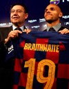 Danish midfielder Martin Braithwaite, right, holds up his new team shirt with FC Barcelona's President Josep Maria Bartomeu during his official presentation after signing for FC Barcelona in Barcelona, Spain, Thursday, Feb. 20, 2020. (AP Photo/Emilio Morenatti)