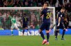 Real Madrid's Mariano Diaz walks as Betis' Cristian Tello celebrates scoring his side's 2nd goal during La Liga soccer match between Betis and Real Madrid at the Benito Villamarin stadium in Seville, Spain, Sunday, March. 8, 2020. (AP Photo/Miguel Morenatti)