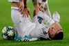 Real Madrid's Eden Hazard reacts injured at the ground during a Champions League soccer match Group A between Real Madrid and Paris Saint Germain at the Santiago Bernabeu stadium in Madrid, Spain, Tuesday, Nov. 26, 2019. (AP Photo/Bernat Armangue)