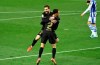Barcelona's Sergino Dest celebrates with Lionel Messi scoring his side's 3rd goal during the Spanish La Liga soccer match between Real Sociedad and FC Barcelona at Reale Arena stadium in San Sebastian, Spain, Sunday, March. 21, 2021. (AP Photo/Alvaro Barrientos)