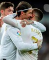 Real Madrid's Sergio Ramos celebrates with Eden Hazard scoring his side's 2nd goal during the Spanish La Liga soccer match between Real Madrid and Celta de Vigo at the Santiago Bernabeu stadium in Madrid, Spain, Sunday, Feb. 16, 2020. (AP Photo/Manu Fernandez)
