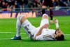 Real Madrid's Karim Benzema reacts at the ground during the Spanish La Liga soccer match between Real Madrid and Celta de Vigo at the Santiago Bernabeu stadium in Madrid, Spain, Sunday, Feb. 16, 2020. (AP Photo/Manu Fernandez)