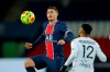 PSG's Marco Verratti, left, jumps for the ball past Lorient's Sylvain Marveaux during the French League One soccer match between Paris Saint-Germain and Lorient at the Parc des Princes in Paris, France, Wednesday, Dec. 16, 2020. (AP Photo/Christophe Ena)