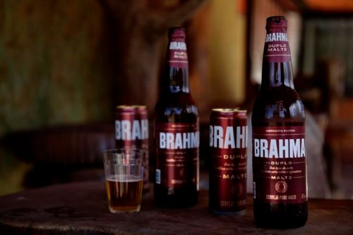 Brahma beer is displayed at a bar that's open for deliveries only amid the COVID-19 pandemic in Brasilia, Brazil, Tuesday, July 14, 2020. An interfaith coalition is pressuring the world’s largest brewer to remove the name of the Hindu god, saying the name is offensive to Hindus, who worship Lord Brahma, the religion's god of creation. An Anheuser-Busch InBev brewery spokesman says the beer actually was named to honor Joseph Bramah, an Englishman who invented the draft pump handle, and the spelling was changed to adapt the name to the Portuguese language. (AP Photo/Eraldo Peres)