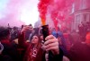 Football supporters set off flares before the English Premier League soccer match between Liverpool and Manchester United near Anfield Stadium in Liverpool, Sunday, Jan. 19, 2020.(AP Photo/Jon Super)
