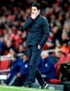 Arsenal's head coach Mikel Arteta reacts during the Europa League round of 32, second leg, soccer match between Arsenal and Olympiakos at Emirates stadium in London, England, Thursday, Feb. 27, 2020 . (AP Photo/Frank Augstein)