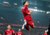 Liverpool's Virgil van Dijk jumps to celebrate scoring his side's first goal during the English Premier League soccer match between Liverpool and Manchester United at Anfield Stadium in Liverpool, Sunday, Jan. 19, 2020.(AP Photo/Jon Super)