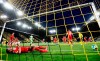 Union's Robin Knoche reacts as Dortmund's Marco Reus, left, celebrates scoring his side's first goal during the German Bundesliga soccer match between Borussia Dortmund and Union Berlin in Dortmund, Germany, Wednesday, April 21, 2021.(AP Photo/Martin Meissner, pool)