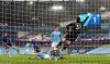 Chelsea's Marcos Alonso, left, scores the winning goal during the English Premier League soccer match between Manchester City and Chelsea at the Etihad Stadium in Manchester, Saturday, May 8, 2021.(Shaun Botterill /Pool via AP)