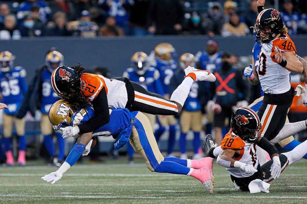 CP
Winnipeg Blue Bombers' Janarion Grant (80) gets tackled by B.C. Lions' Jordan Williams (21) as he attempts to get the first down during the first half. (John Woods / The Canadian Press)