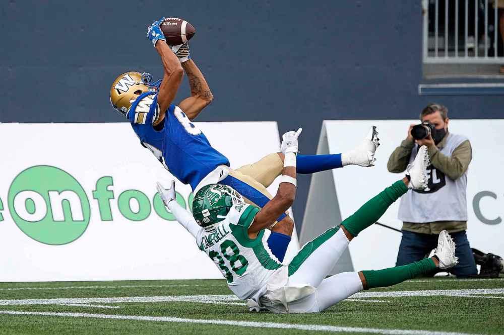 CP
Winnipeg Blue Bombers' Kenny Lawler (89) catches the touchdown pass against Saskatchewan Roughriders' Christian Campbell (38) during the second half. (John Woods / The Canadian Press)