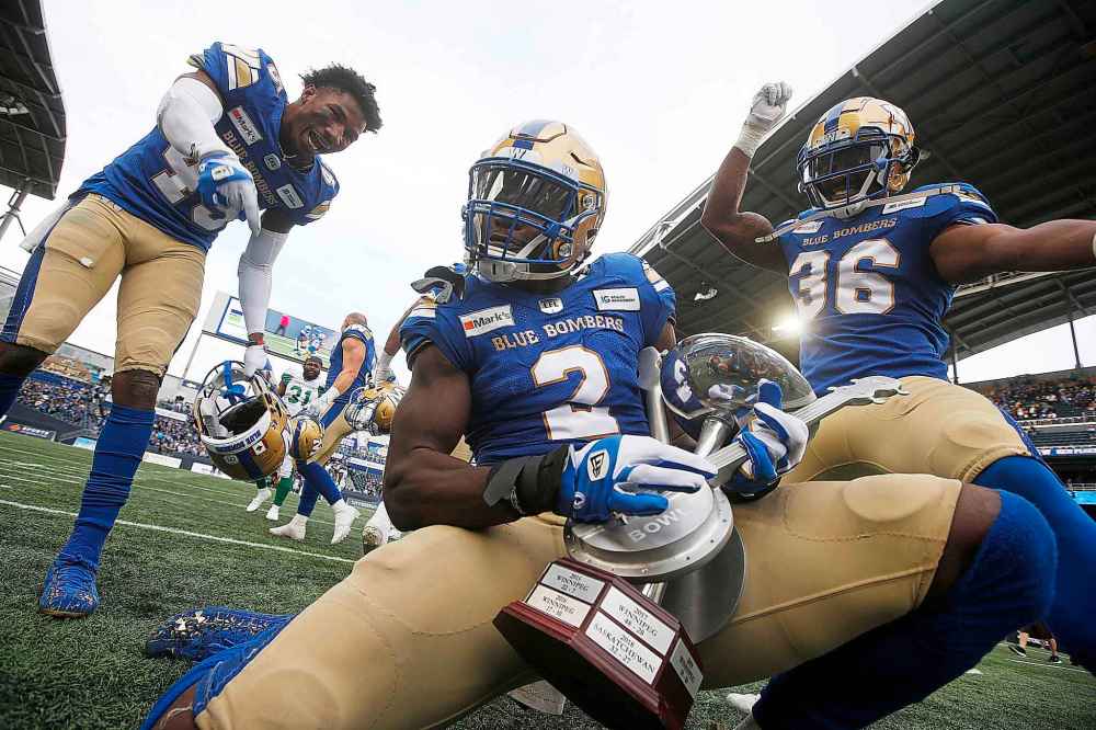 CP
Winnipeg Blue Bombers' DeAundre Alford (45), Jonathan Kongbo (2) and Jontrell Rocquemore (36) celebrate a Banjo Bowl win over the Saskatchewan Roughriders in CFL action in Winnipeg Saturday, September 11, 2021. (John Woods / The Canadian Press)