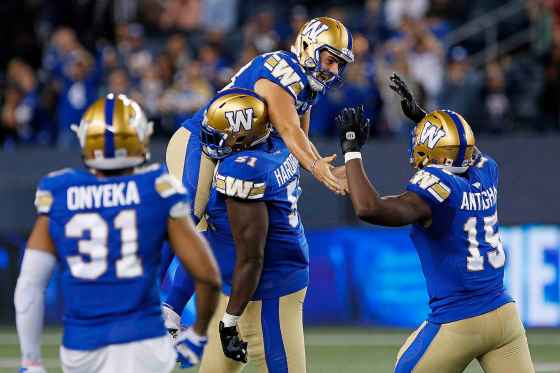THE CANADIAN PRESSWinnipeg Blue Bombers' kicker Marc Liegghio (13) celebrates with Jermarcus Hardrick (51) and Tobi Antigha (15) after kicking the game winning field goal against the Calgary Stampeders during second half CFL football action in Winnipeg, Sunday, Aug. 29, 2021. (John Woods / The Canadian Press)