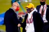 Tampa Bay Buccaneers owner Joel Glazer, left, talks with Washington Football Team owner Daniel Snyder, right, before an NFL wild-card playoff football game Saturday, Jan. 9, 2021, in Landover, Md. (AP Photo/Andrew Harnik)