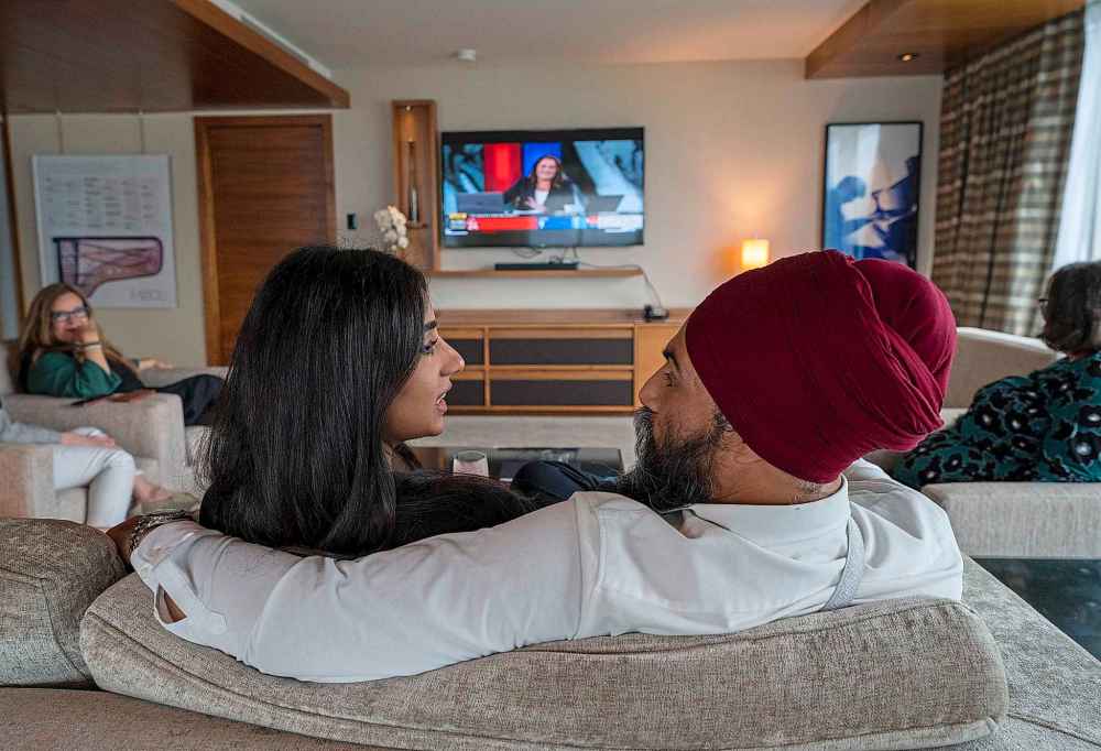 NDP Leader Jagmeet Singh and his wife Gurkiran Kaur Sidhu watch the election results come in on tv from a hotel in downtown Vancouver, B.C., Monday, Sept. 20, 2021. THE CANADIAN PRESS/Jonathan Hayward