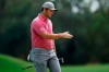 Jon Rahm, of Spain, reacts after missing a putt on the first hole during the final round of The Players Championship golf tournament Sunday, March 14, 2021, in Ponte Vedra Beach, Fla. (AP Photo/Gerald Herbert)