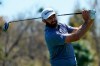 Dustin Johnson watches his tee shot on the ninth hole during the second round of the The Players Championship golf tournament Friday, March 12, 2021, in Ponte Vedra Beach, Fla. (AP Photo/John Raoux)