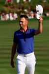 Justin Thomas waves on the 18th green after the final round of The Players Championship golf tournament Sunday, March 14, 2021, in Ponte Vedra Beach, Fla. (AP Photo/John Raoux)