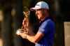 Justin Thomas holds the trophy after winning The Players Championship golf tournament Sunday, March 14, 2021, in Ponte Vedra Beach, Fla. (AP Photo/Gerald Herbert)