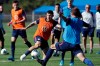 Paul Arriola, center, a forward on the U.S. Men's National Soccer team, kicks the ball during a scrimmage Wednesday, Jan. 8, 2020, in Bradenton, Fla. The team moved its training camp from Qatar to Florida in the wake of Iran's top military commander being killed during a U.S. airstrike in the Middle East. (AP Photo/Chris O'Meara)