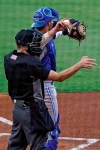 Home plate umpire Kaleb Devier calls a strike during a Low A Southeast League baseball game between the Dunedin Blue Jays and the Tampa Tarpons at George M. Steinbrenner Field Tuesday, May 4, 2021, in Tampa, Fla. The game is one of the first in the league to use automatic balls and strike calls. (AP Photo/Chris O'Meara)