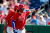 Philadelphia Phillies' Bryce Harper waves to fans after his two-run home run during the fourth inning of a spring training baseball game against the Pittsburgh Pirates, Wednesday, March 4, 2020, in Clearwater, Fla. (AP Photo/Carlos Osorio)