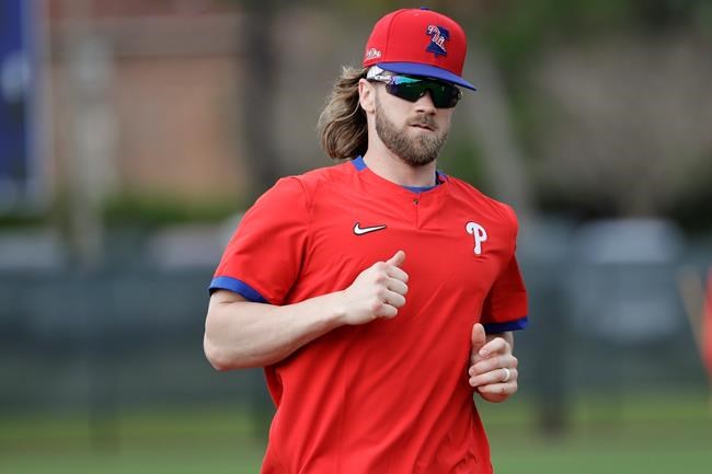 Philadelphia Philies' Bryce Harper runs during a spring training baseball workout Wednesday, Feb. 19, 2020, in Clearwater, Fla. (AP Photo/Frank Franklin II)