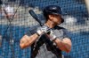 New York Yankees' Giancarlo Stanton takes batting practice during a spring training baseball workout Tuesday, Feb. 18, 2020, in Tampa, Fla. (AP Photo/Frank Franklin II)