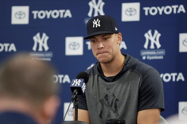 New York Yankees' Aaron Judge pauses while speaking at a news conferece after a spring training baseball workout Tuesday, Feb. 18, 2020, in Tampa, Fla. (AP Photo/Frank Franklin II)