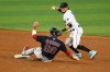 Miami Marlins shortstop Miguel Rojas throws to first after forcing out Boston Red Sox's Alex Verdugo at second during the sixth inning of a baseball game, Thursday, Sept. 17, 2020, in Miami. (AP Photo/Gaston De Cardenas)