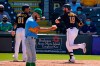 Pittsburgh Pirates' Colin Moran (19) celebrates with Nick Gonzalez (81) after hitting a two-run home run off Tampa Bay Rays pitcher Nick Anderson, center, during the fifth inning of a spring training exhibition baseball game in Bradenton, Fla., Wednesday, March 17, 2021. (AP Photo/Gene J. Puskar)