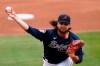 Atlanta Braves starting pitcher Bryse Wilson (46) works in the first inning of a spring training baseball game against the Boston Red Sox Saturday, March 20, 2021, in North Port, Fla. (AP Photo/John Bazemore)