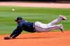 Atlanta Braves first baseman Pablo Sandoval can't reach a ball hit for a single by Tampa Bay Rays' Willy Adames in the fifth inning of a spring training baseball game Sunday, March 21, 2021, in Port Charlotte, Fla. (AP Photo/John Bazemore)